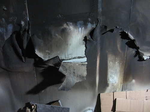 Outer wall of ModuSec computer room facing fire